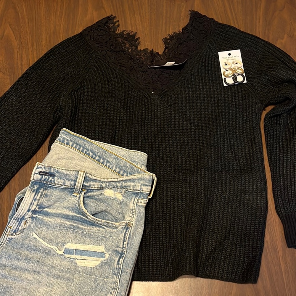 Black off the shoulder sweater. NWT size M/L